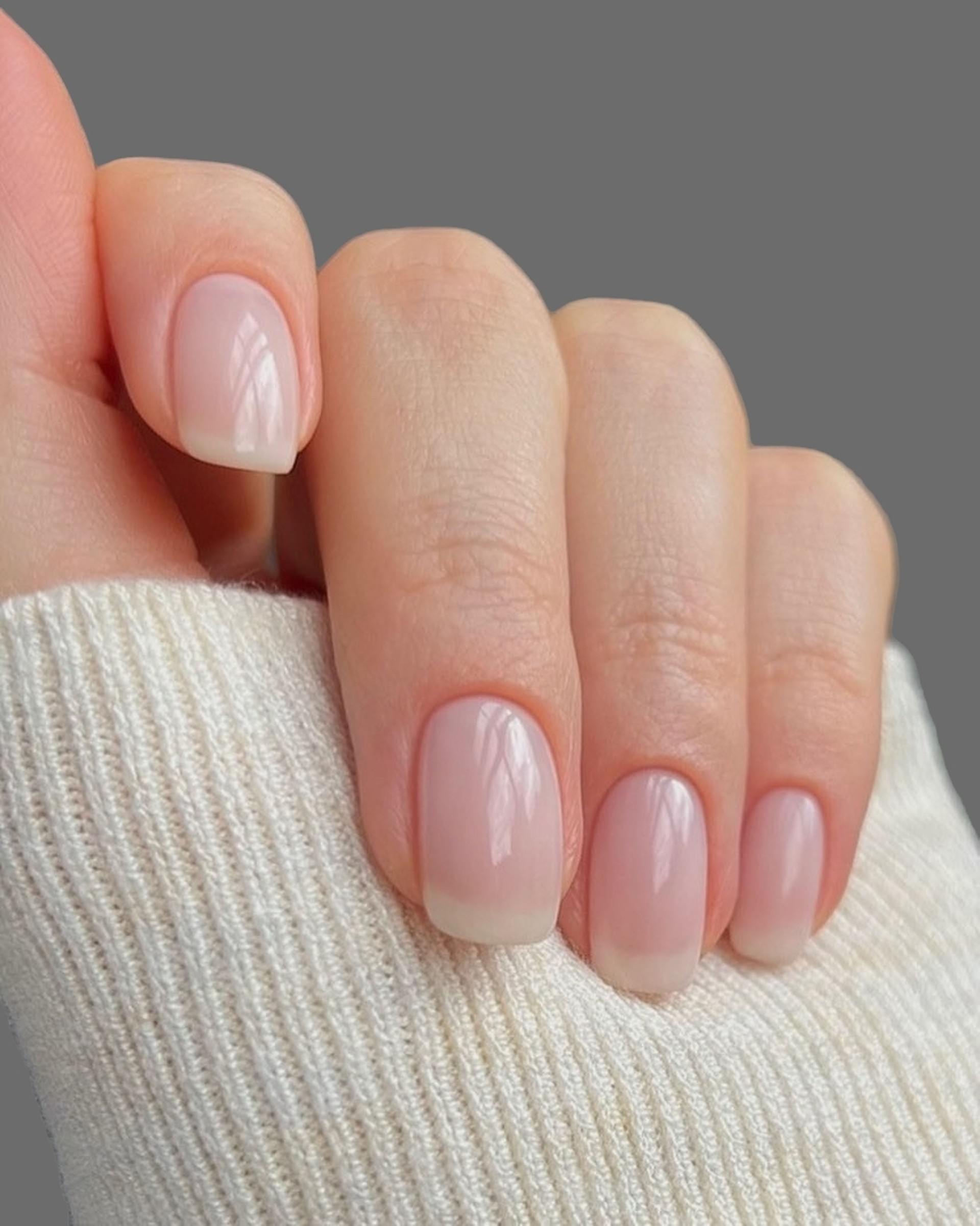 Young woman's hands with light manicure and light background _ Soft woman's hands with transparent manicure
